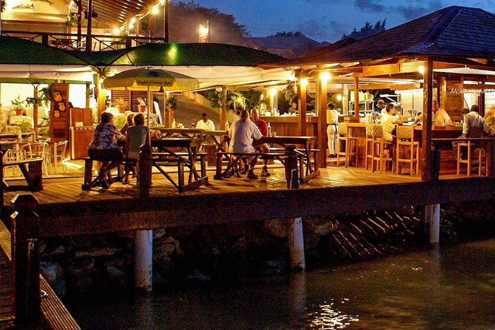 The wharves and quays buzz with Antiguan spirit as the sun sets