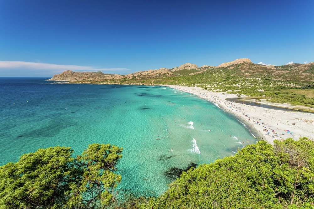 Facing the north west and backed by a lagoon and verdant scrub