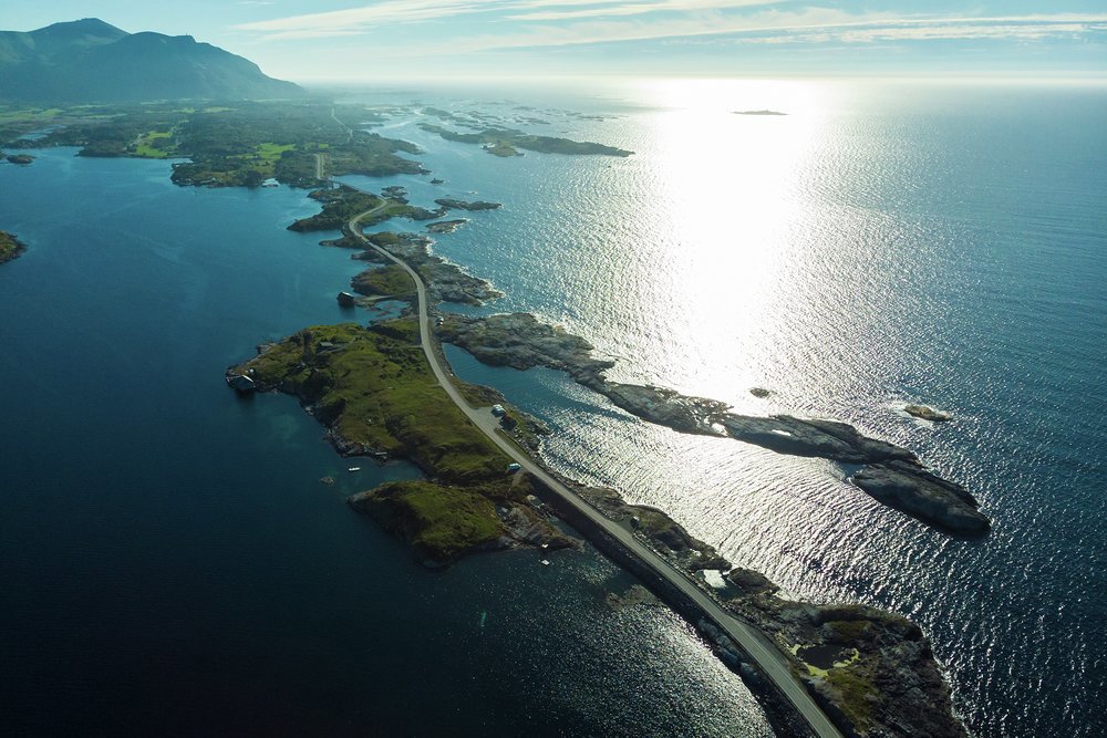 The famous Atlantic Road, as featured in 007 movie No Time To Die, skips from skerry to skerry to link Kårvåg on the island of Averøya to Vevang on the mainland
