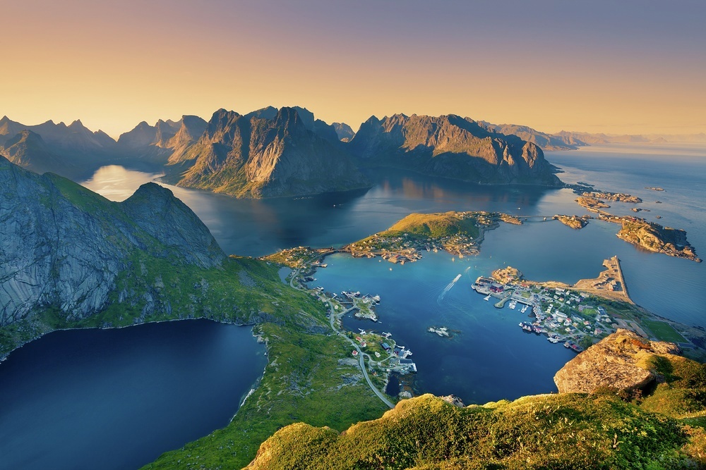The midnight summer sun casts a golden light over the Lotofen Islands