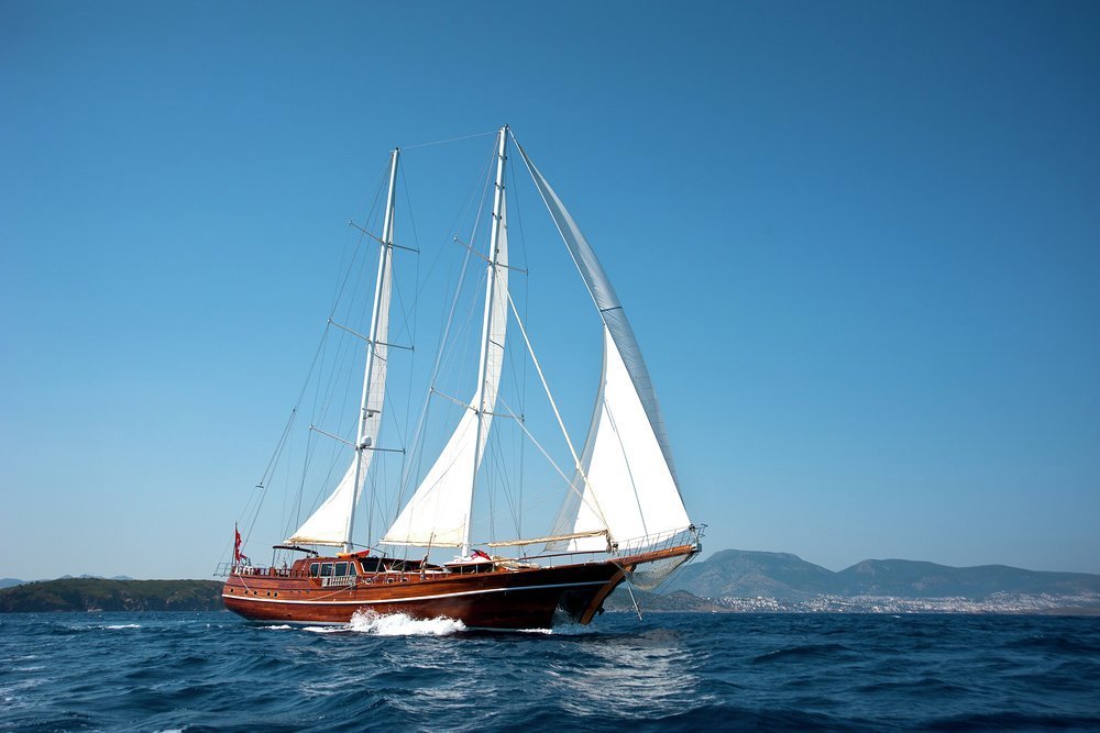 The traditional sailing gulets still ply their trade, albeit a different one, in these crystal clear waters
