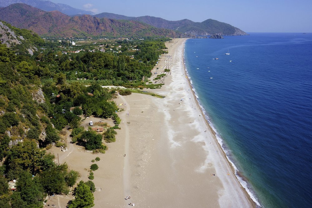 The pebbly Olympos Beach, home to the Eternal Flame, has a real Boho vibe