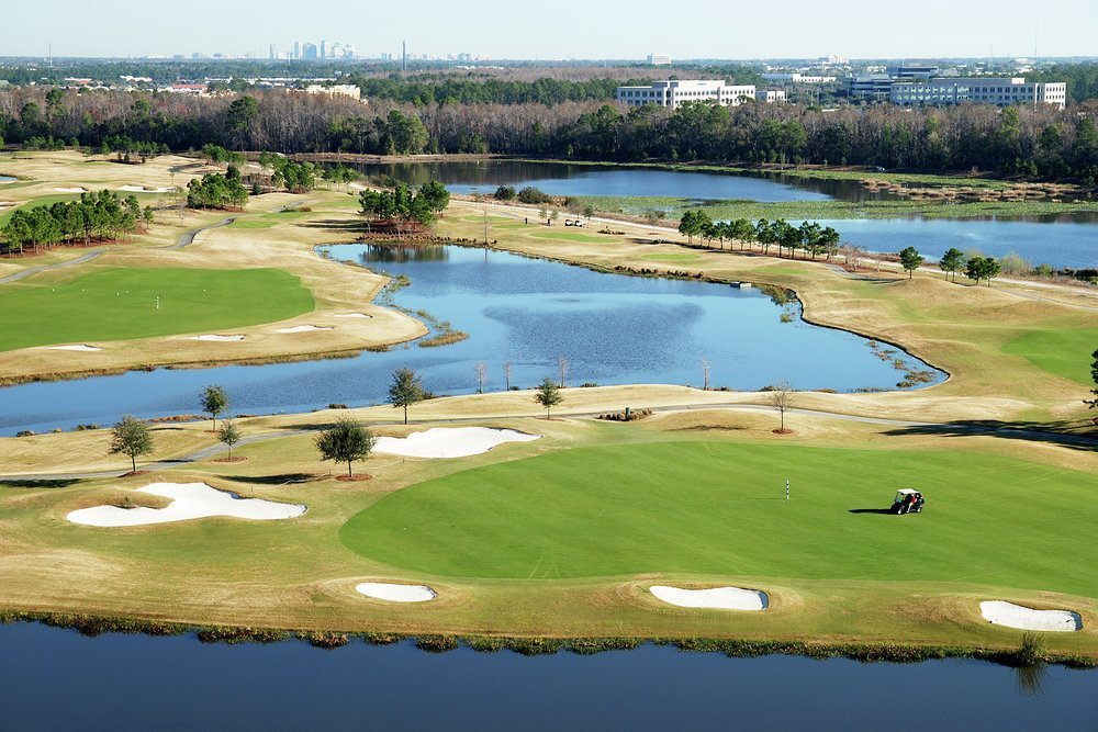 Mix golf with bass fishing at a course that has Orlando shimmering in the background