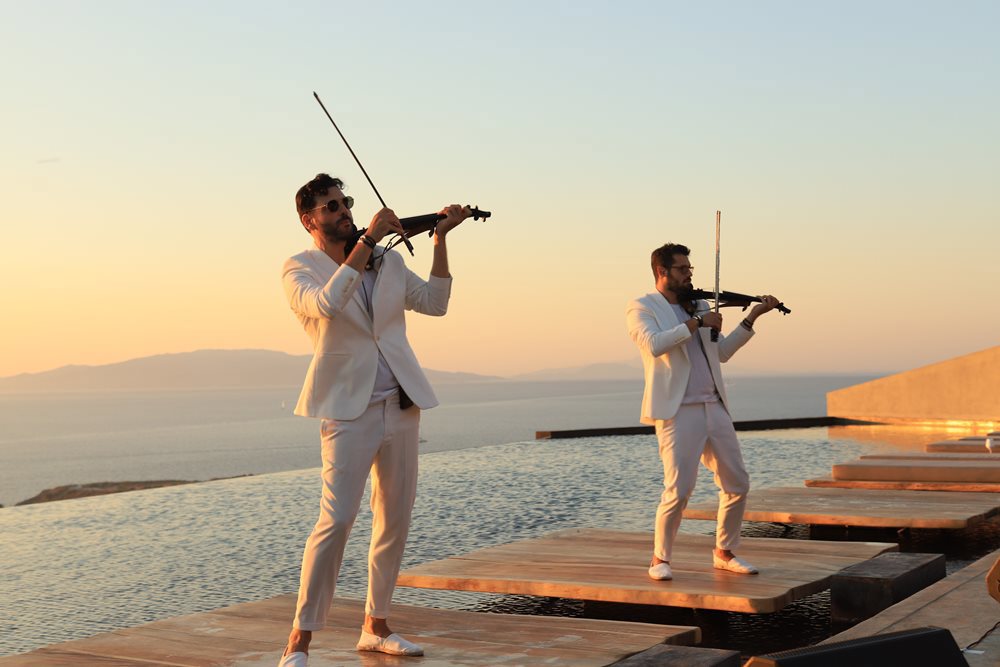 Violin players at sunset