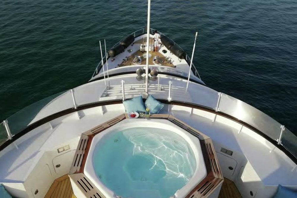 Her jacuzzi is screened from the breeze and overlooks the foredeck