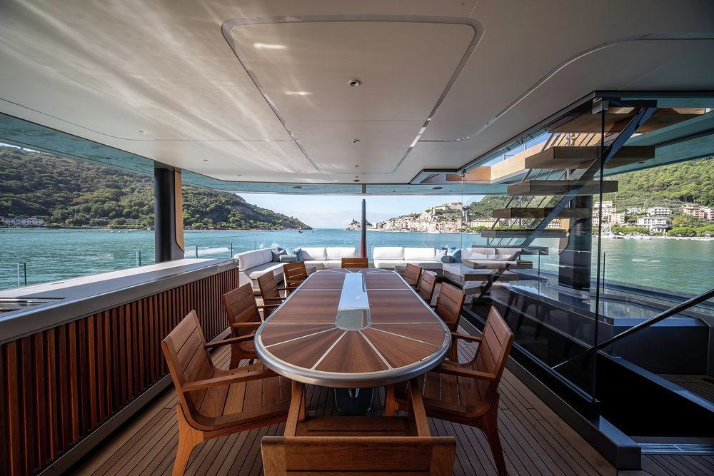 The bridge deck has a generously sized open-air dining table with a lounge aft where guests can take a digestif after dinner