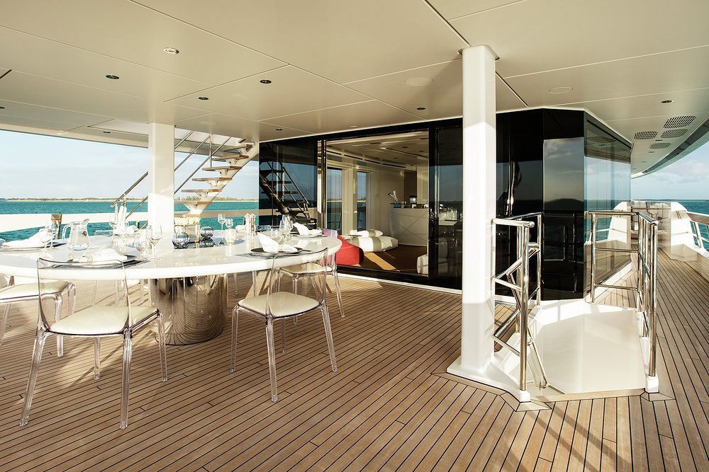 Open air dining on the upper deck aft