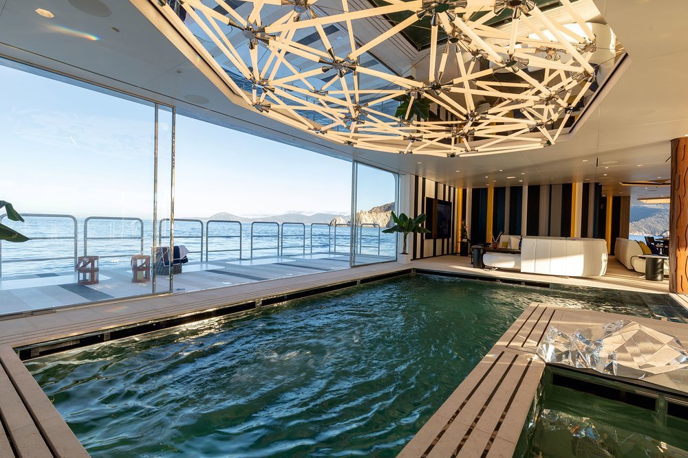 A 50sqm sea terrace outside a 30sqm counter flow pool, with a bottom that rises to become a dancefloor