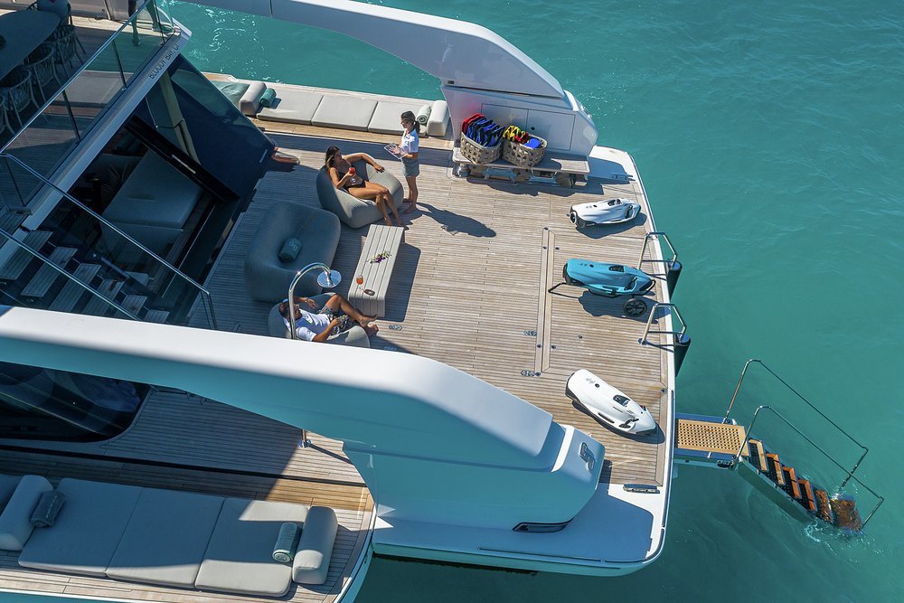 The huge swim platform serves as tender and toy stowage underway, recovered with a cleverly concealed deck crane