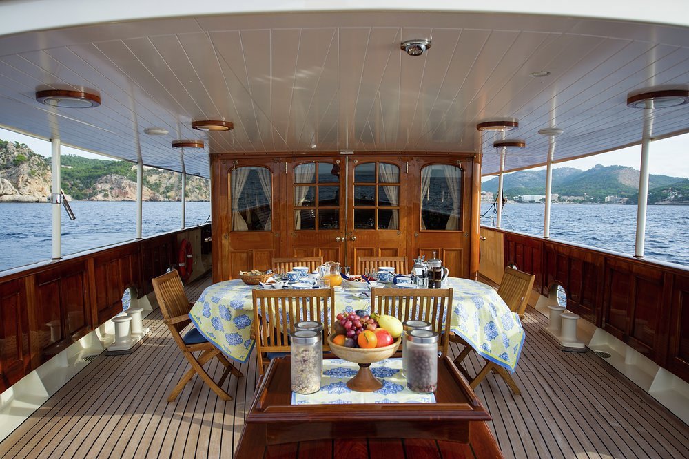 Covered open air dining on the main deck aft