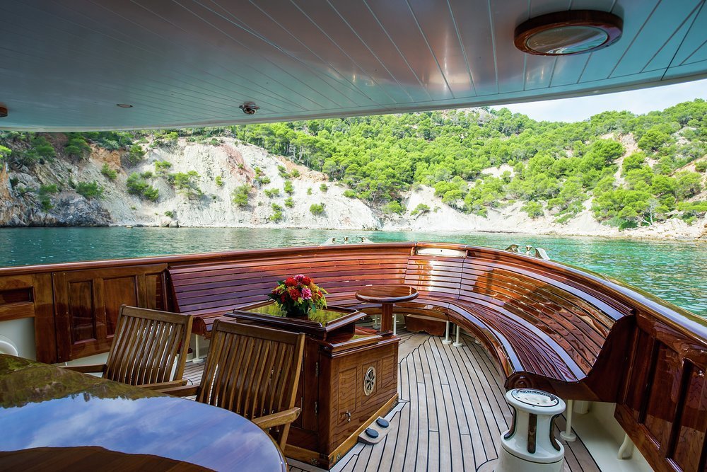 A Parisian bench arcs elegantly around the main deck aft