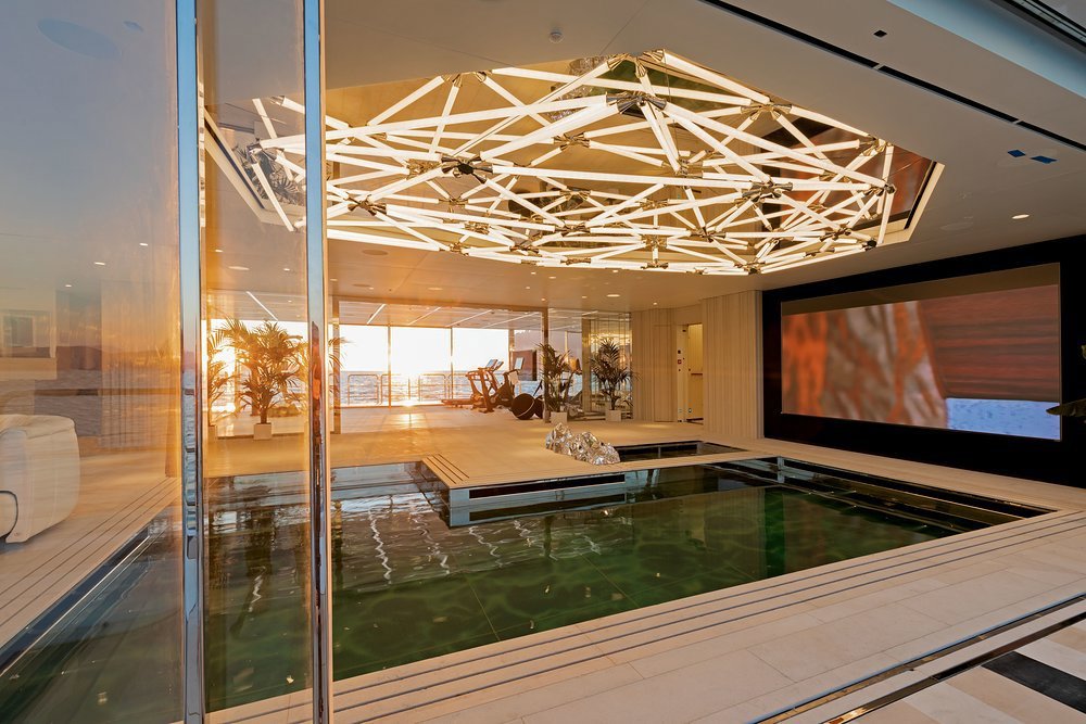 Looking from the starboard sea terrace, across the pool to the gym and the port sea terrace