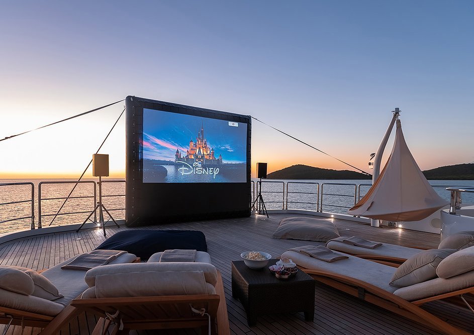 An outdoor cinema screen delivers movies under the stars