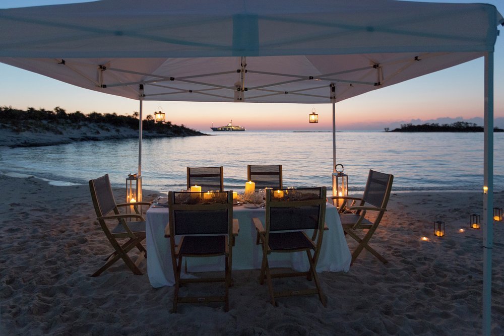 After a day's fun on the water, feel the sand between your toes dining on a secluded beach