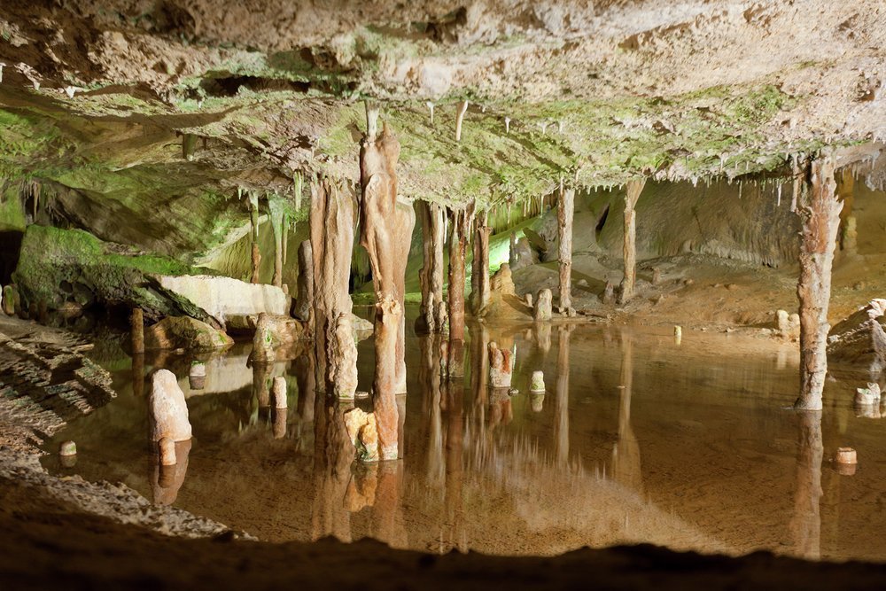 Escape the heat of the day by exploring the caves of Can Marçà